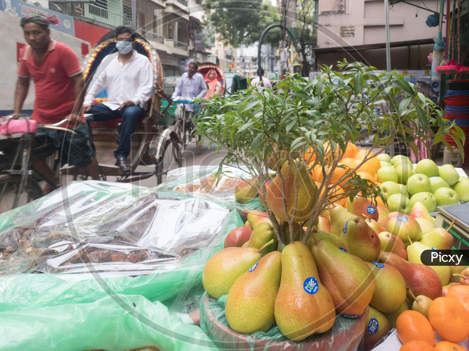 Fruits of Asia and rickshaw passing away