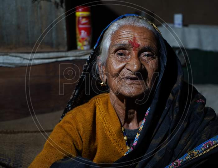 Almora, India - September 06, 2020: Low Key Portrait Of A Village Woman, Wearing Traditional Clothes.