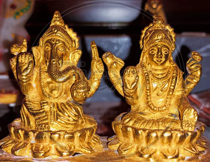 Lord ganesha and sarasvati gold murtii