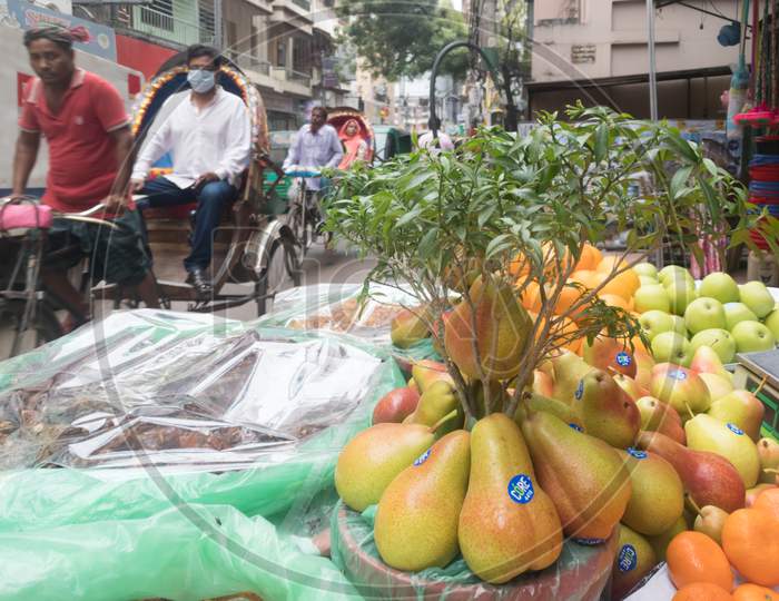 Fruits of Asia and rickshaw passing away