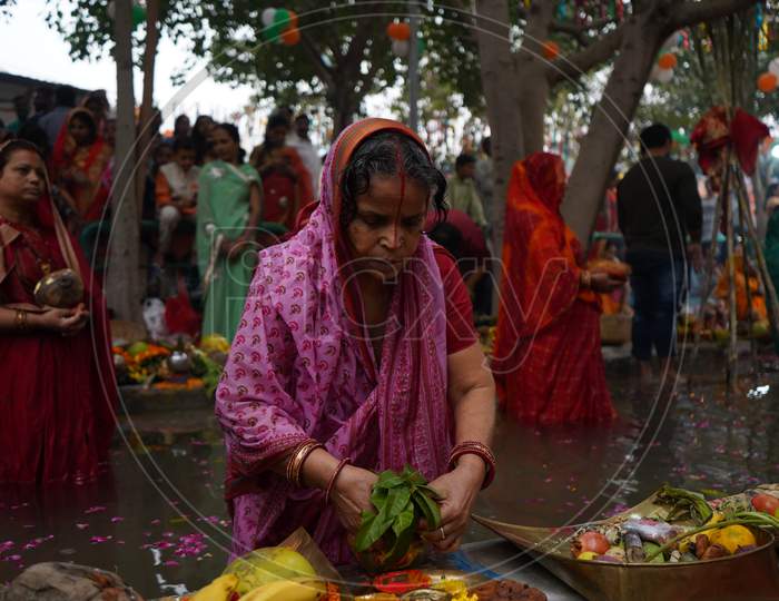 New Delhi, Delhi/ India- October 24 2020 : Women Of India Celebrating Chhath Pooja By Drowning Themselves In Water For Praying To Sun.