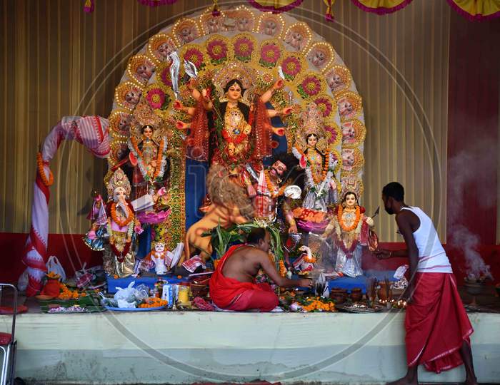 Priest  offer prayers at a community pandal during the Maha  navami  of Durga Puja, in Guwahati on Oct 25,2020