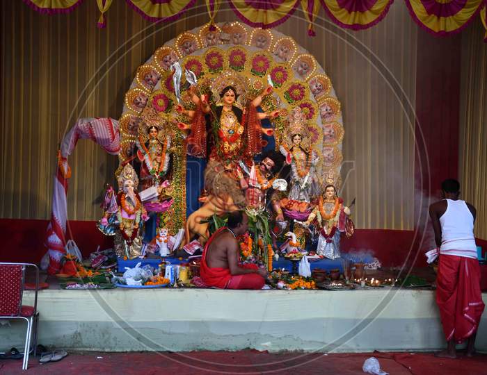 Devotees offer prayers at a community pandal during the Maha  navami  of Durga Puja, in Guwahati on Oct 25,2020