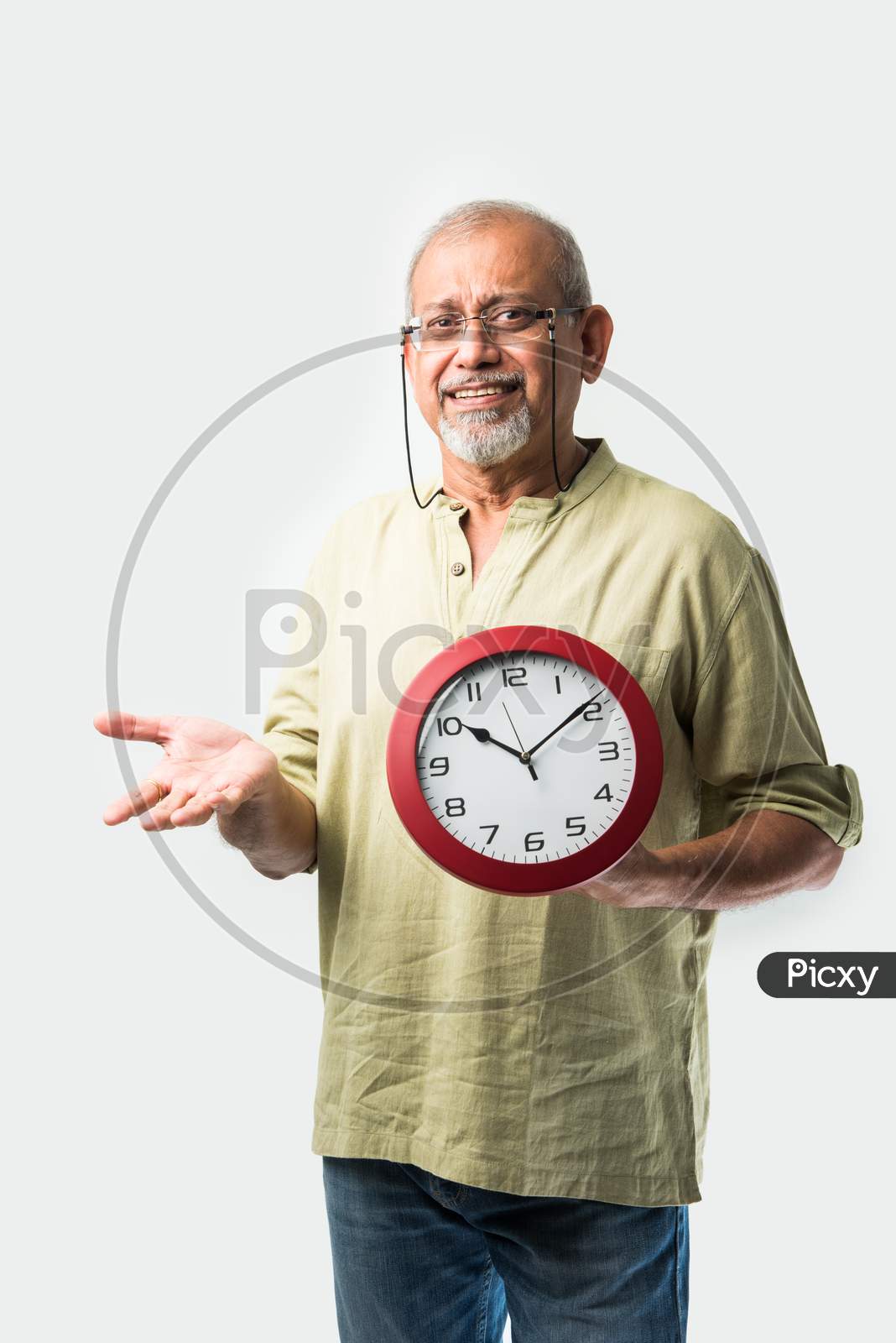 Asian Indian Old Man Holding Or Showing Round Wall Clock Or Watch