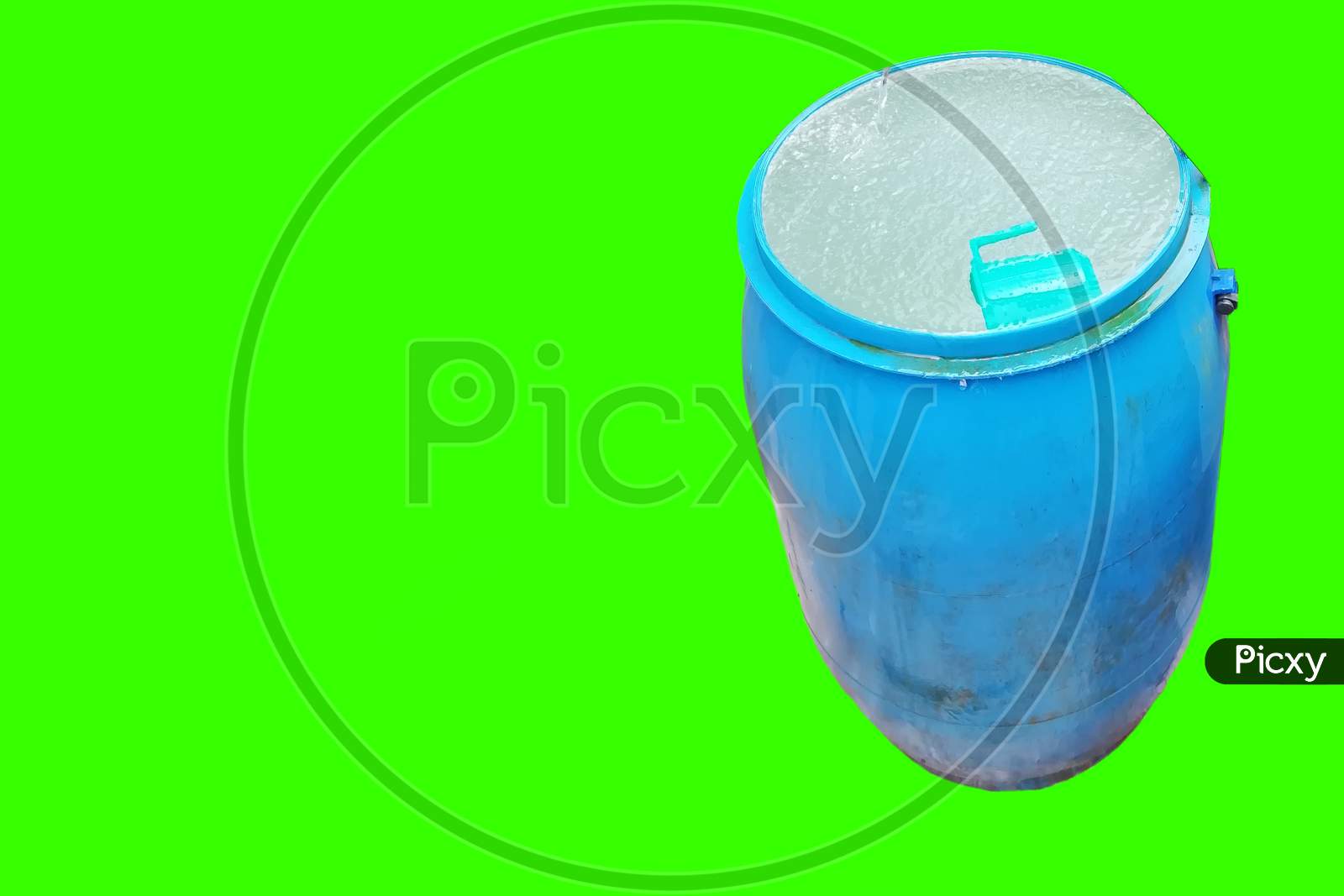 Blue Color Water Tank With Water And Mug Isolated On Green Background