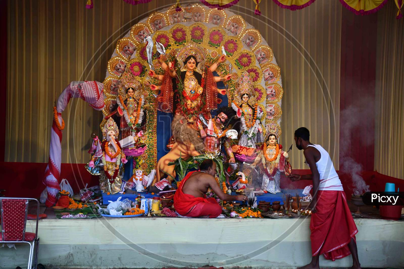 Priest  offer prayers at a community pandal during the Maha  navami  of Durga Puja, in Guwahati on Oct 25,2020