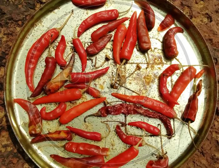 Closeup Of Red Chili Peppers In A Plate Isolated On A Surface