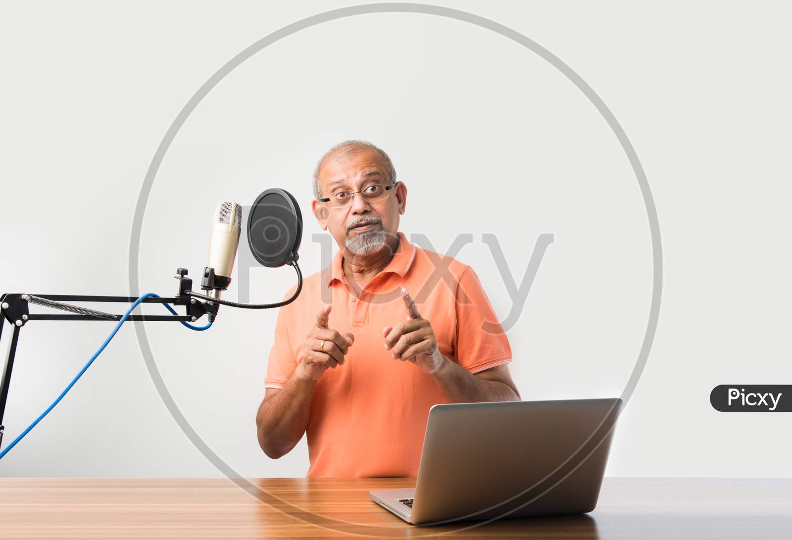 Indian Asian Old Man Video Blogger Speaking In Microphone While Recording A Video In Smartphone