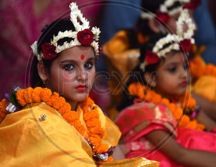 Girls dress as Living Goddess Kumari participate during the Kumari Puja as part of Navratri - a festival of nine days when devotees worship Goddess Durga at Kamakhya Temple in Guwahat on oct 25,2020.