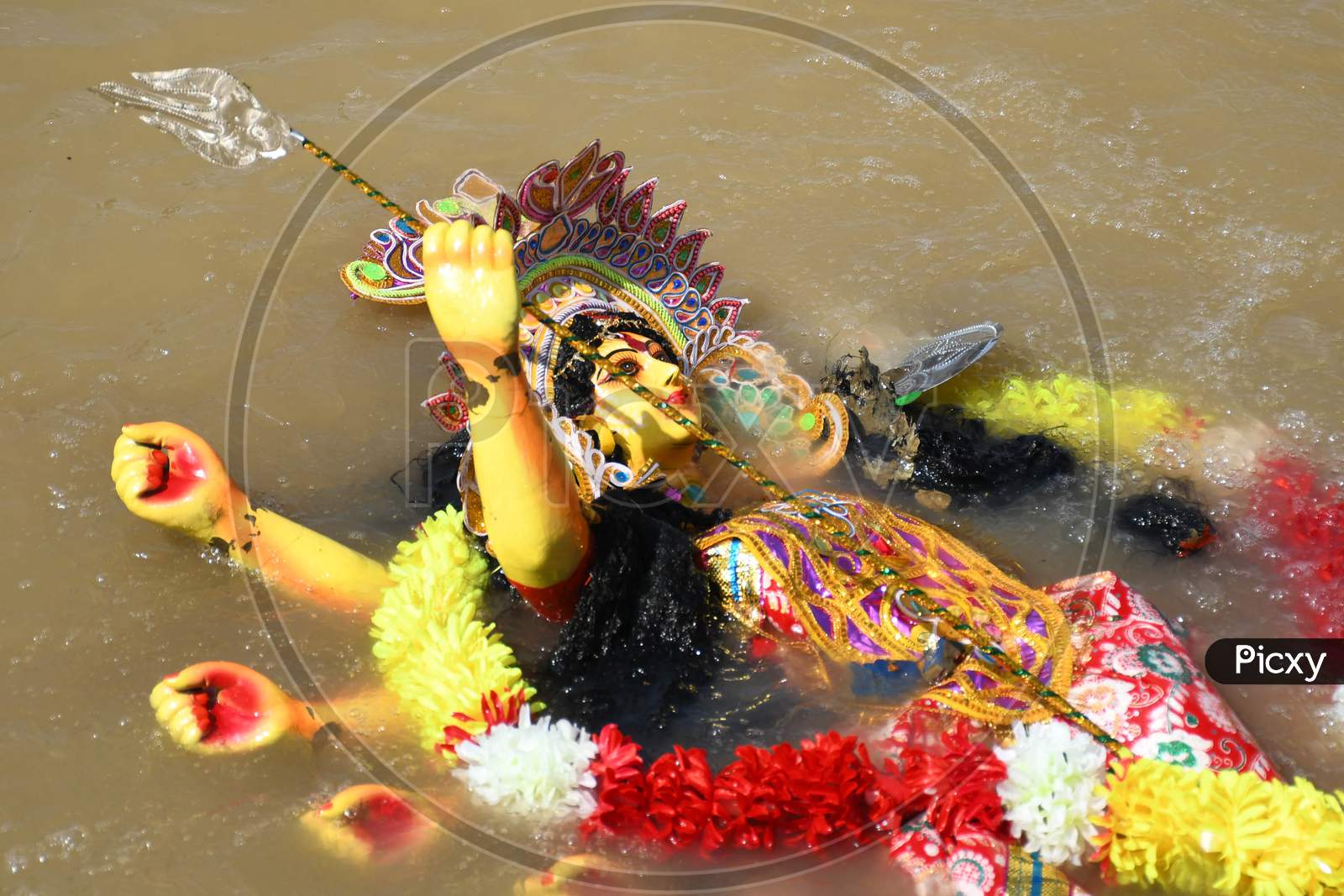 Hindu goddess Durga into the brahmaputra  river during the immersion ceremony of Durga Puja in Guwahati on oct 26,2020