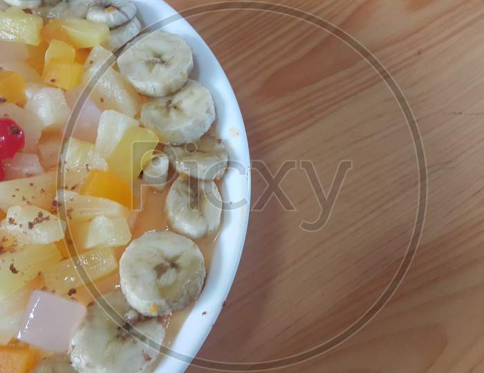Creamy Tasty Sweet Fruit Trifle With Banana Slices Layered On Surface