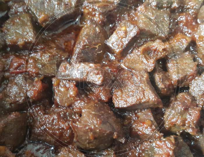 A Close Up View Of Stewed Chicken Liver With spices