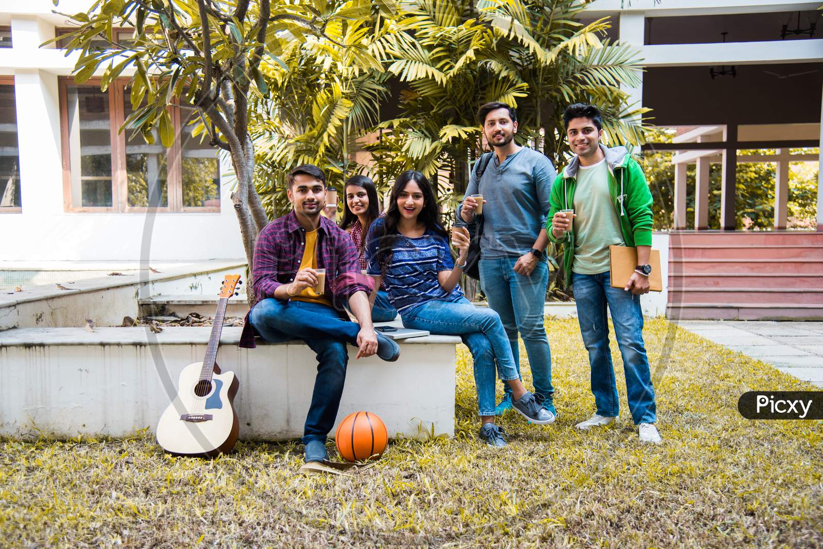 Indian University Students Having Tea Or Coffee In A Break In College Campus