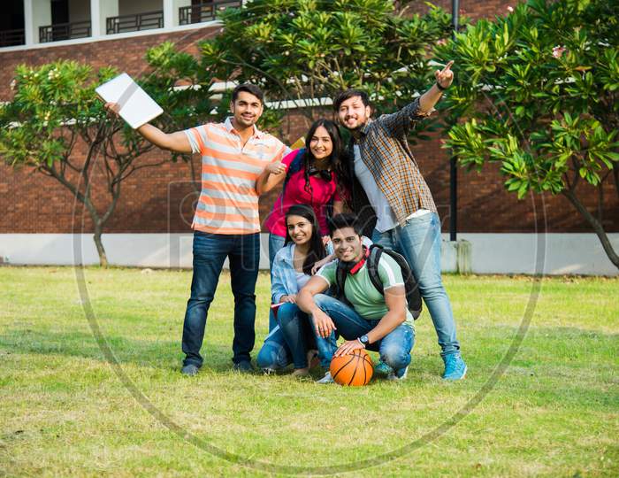 Education Is Fun - Cheerful Indian Asian Young Students Enjoying Togetherness In College Campus
