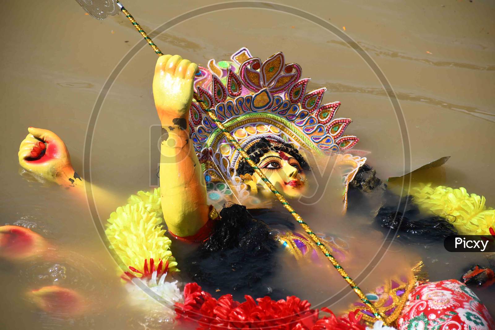 Hindu goddess Durga into the brahmaputra  river during the immersion ceremony of Durga Puja in Guwahati on oct 26,2020