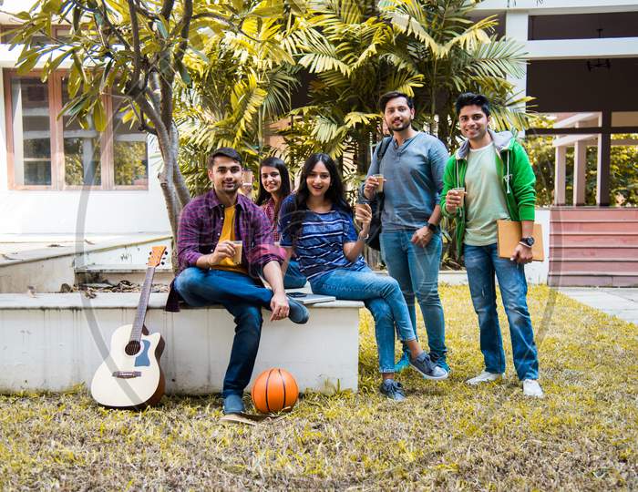 Indian University Students Having Tea Or Coffee In A Break In College Campus