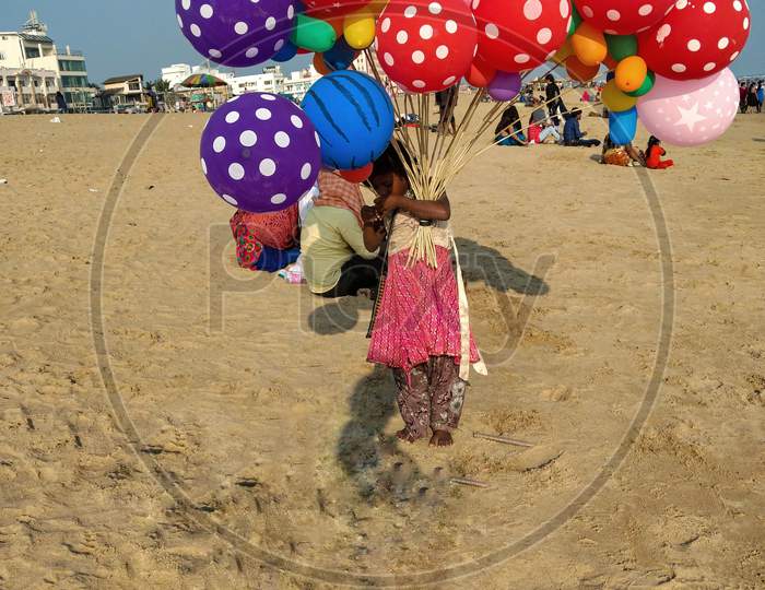 little balloon seller in puri beach