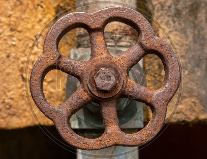 Rusted iron water valve close up, water gate valve with brown color iron stain