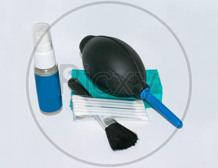 Camera lens cleaning kit isolated on white