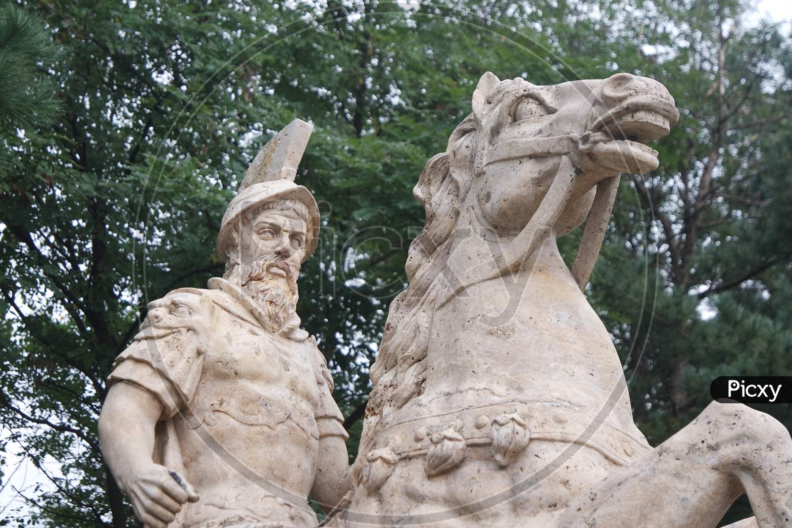 White Marble Statue Of An Ancient Man Riding A Horse