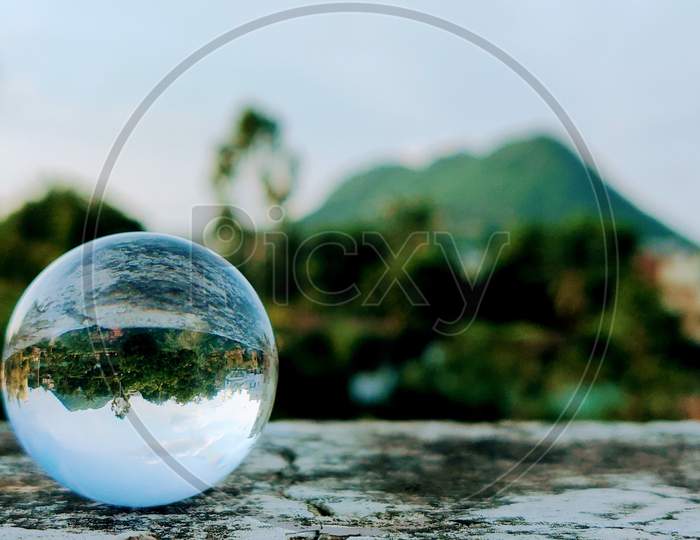 Glass ball and mountains