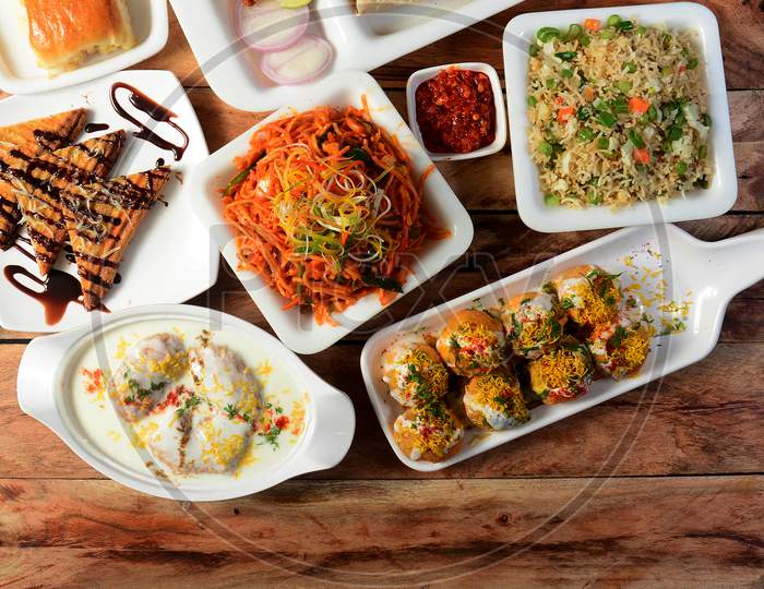 Assorted Indian Food On Wooden Background. Dishes And Appetizers Of Indian Cuisine