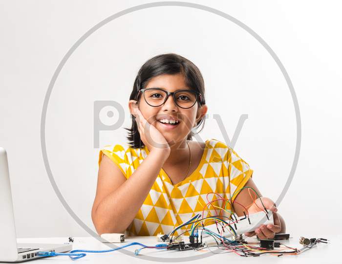 Electronic Experiment - Indian Girl Student Working With Wires And Connections Inventing Something