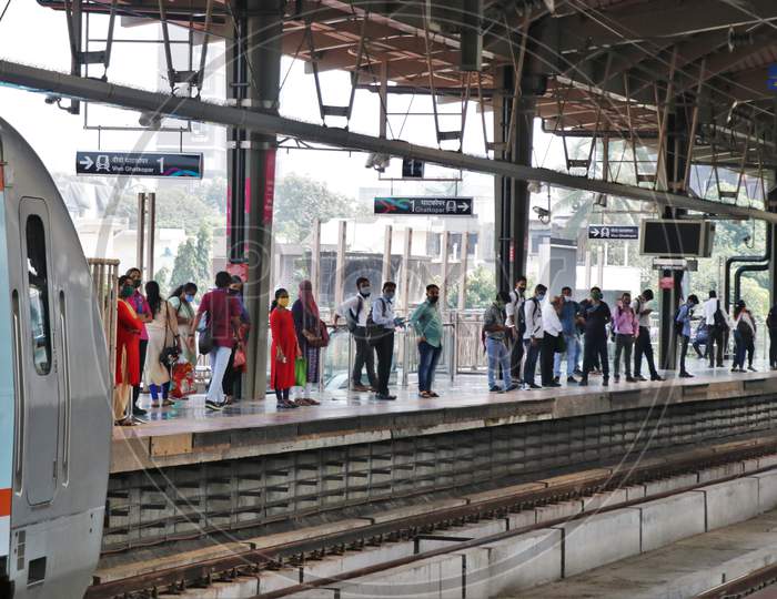 Commuters wait for a train, after authorities resumed the metro services, amidst the coronavirus disease (COVID-19) outbreak, in Mumbai, India, October 28, 2020.