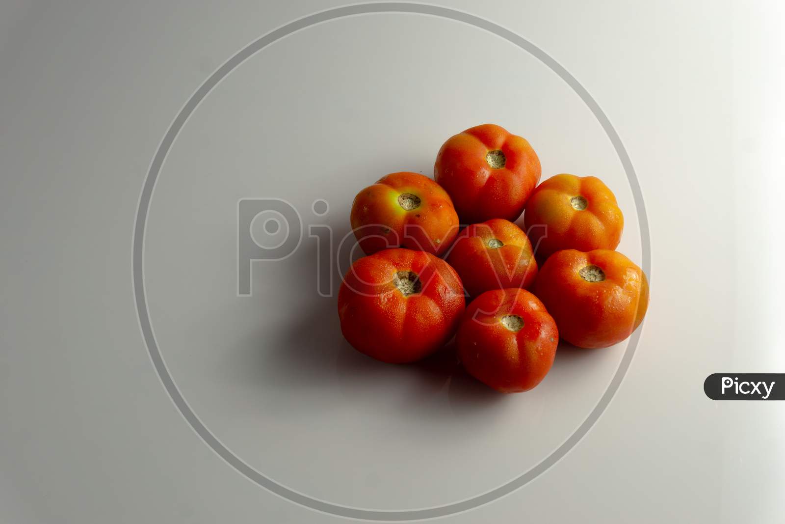 Group Of Red Tomatoes On The Table