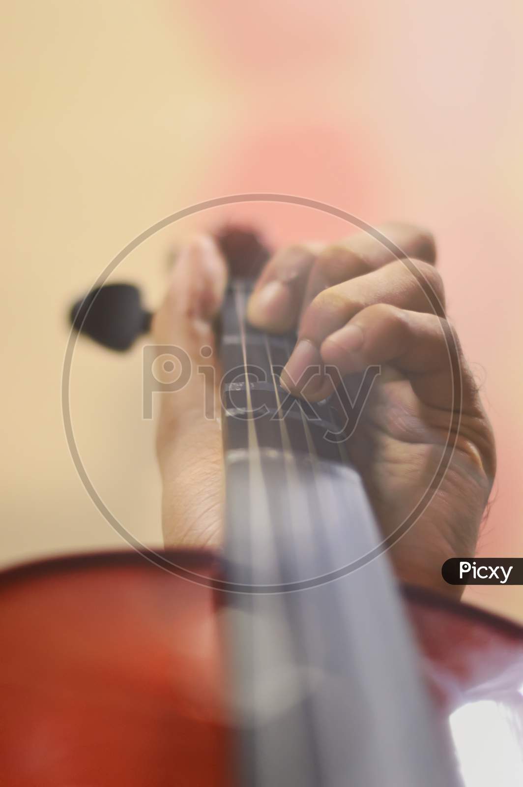 Close Up Image Of Hands Playing A Violin