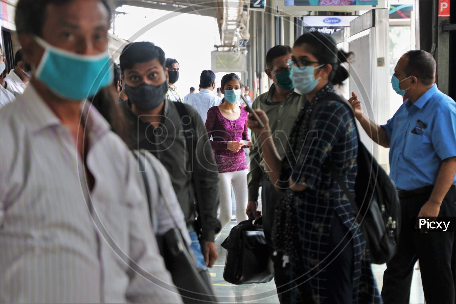 Commuters are seen on a platform, after authorities resumed the metro services, amidst the coronavirus disease (COVID-19) outbreak, in Mumbai, India, October 28, 2020.