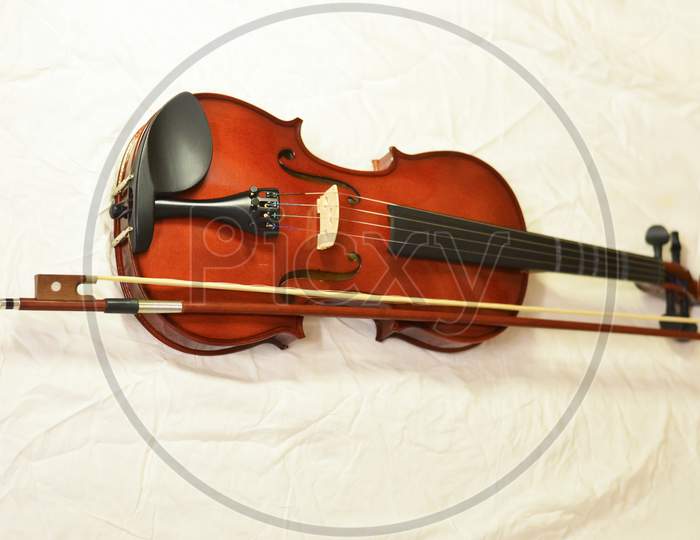 Close Up Shot Of A Violin,On White Background . Blur Photo