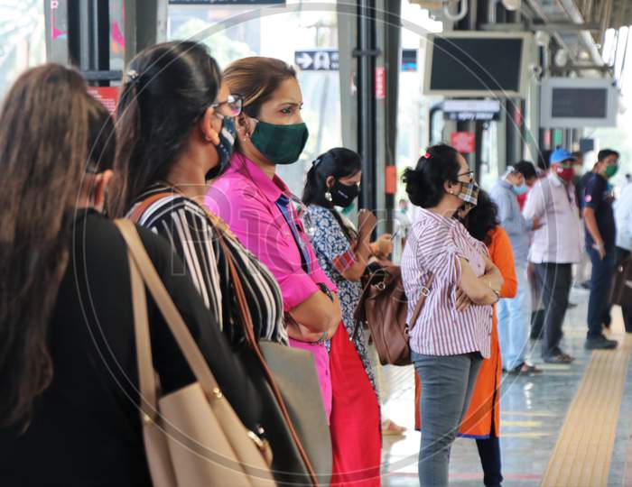 Commuters wait for a train, after authorities resumed the metro services, amidst the coronavirus disease (COVID-19) outbreak, in Mumbai, India, October 28, 2020.