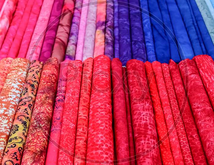 Detailed Close Up View On Samples Of Cloth And Fabrics In Different Colors Found At A Fabrics Market