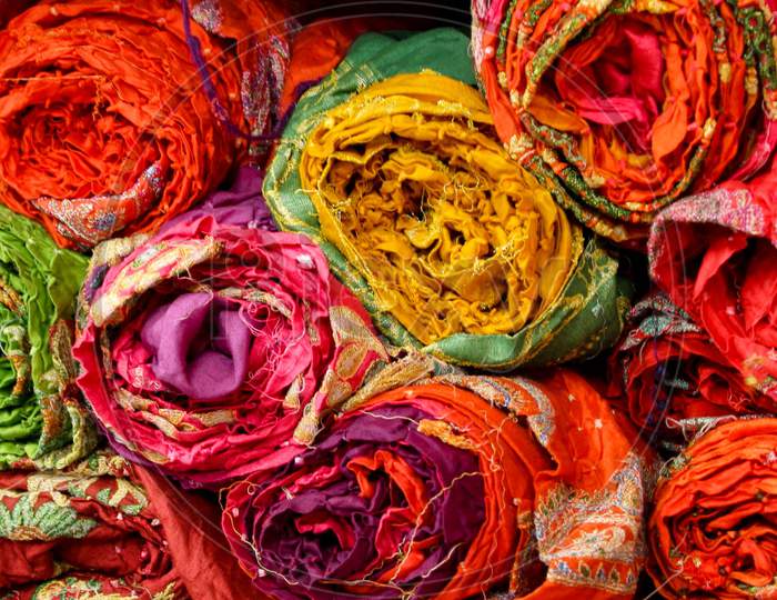colorful cloth bundles in a rajasthani cloths store