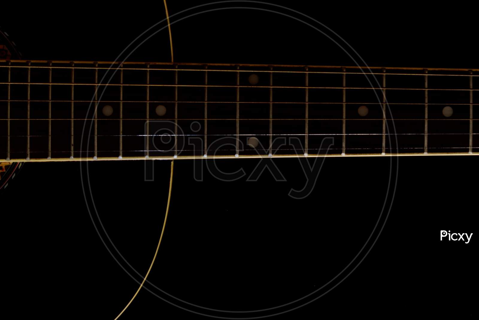 Acoustic Guitar on a dark background