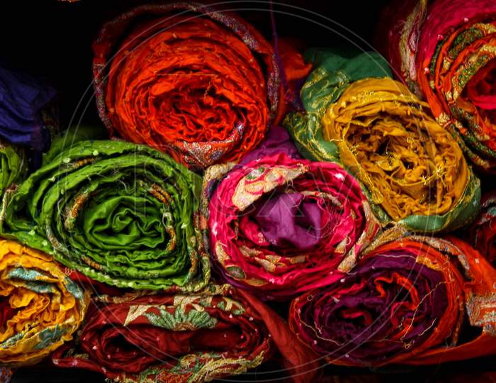 colorful cloth bundles in a rajasthani cloths store
