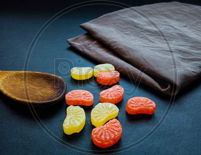 Beautiful sweet orange candy in dark background