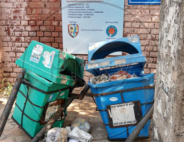 Broken And Damaged Trash Bin Made Of Plastic Box And Placed On Steel Pillars Representing Clean India Movement