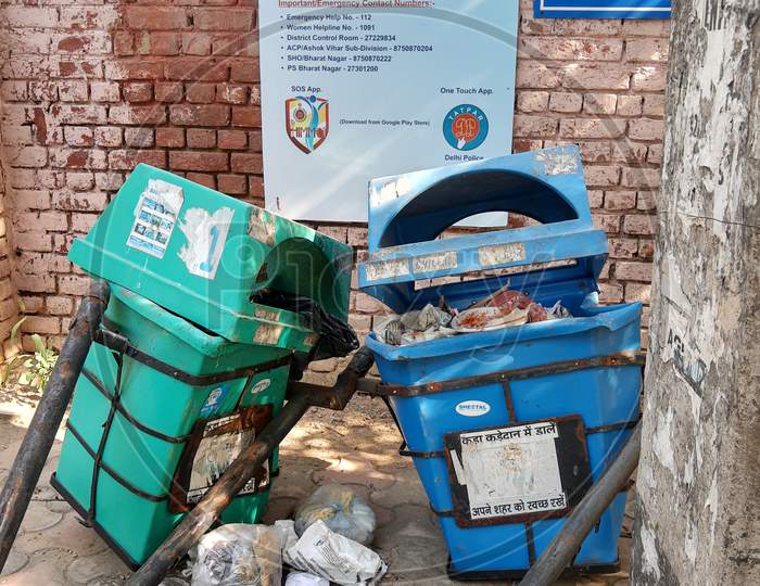 Broken And Damaged Trash Bin Made Of Plastic Box And Placed On Steel Pillars Representing Clean India Movement