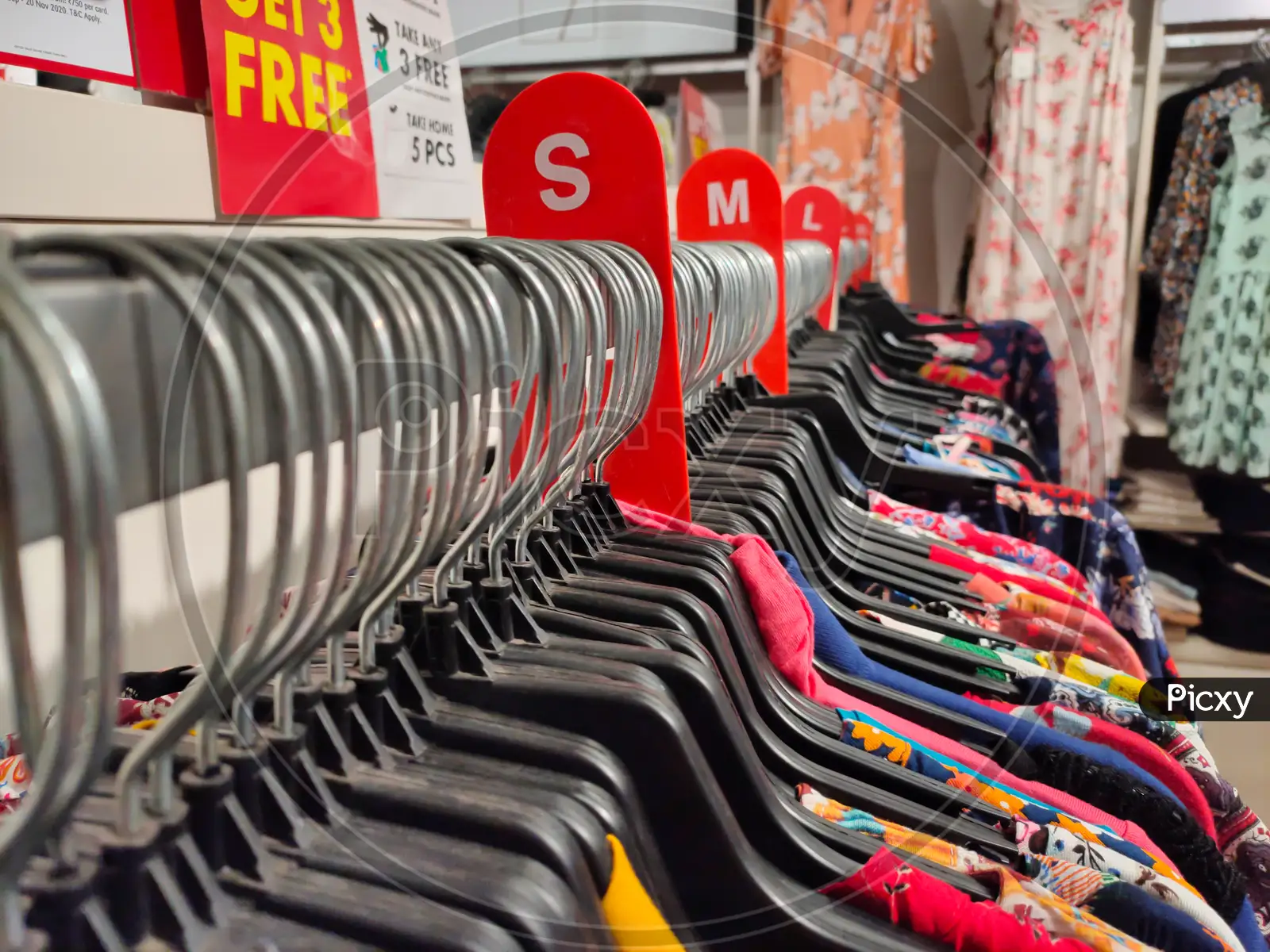 Rows Of Colorful Tshirt Tops Hanging On Coat Hangers From A Rail For Sale  In A High Street Womens Fashion Store Stock Photo - Download Image Now -  iStock