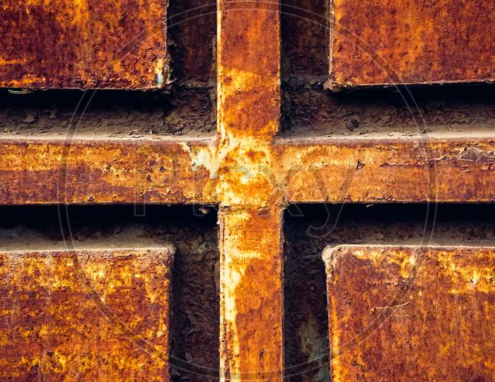 Cross Plus Sign On Rusted Metal Gate