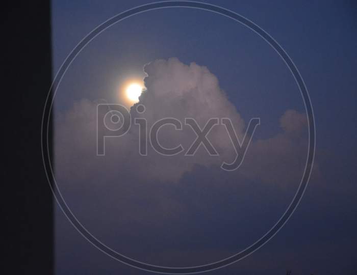 Moon behind the clouds