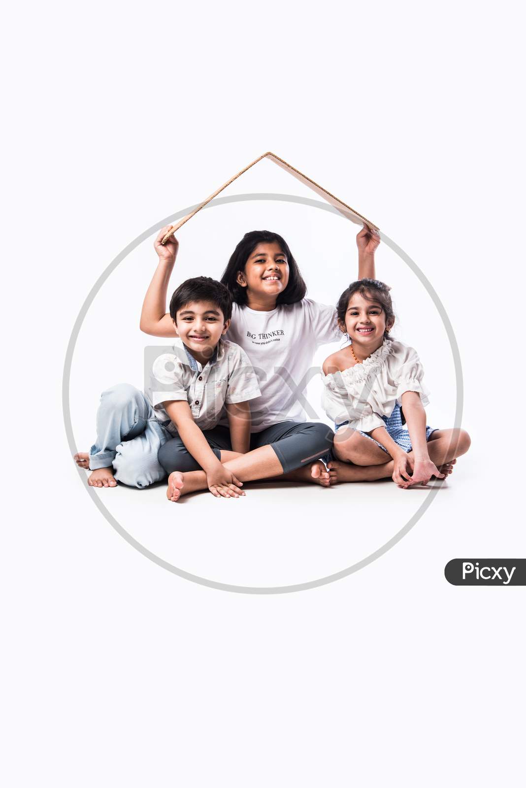 Real Estate Concept - Indian Cute Little Kids Holding #D Paper Model