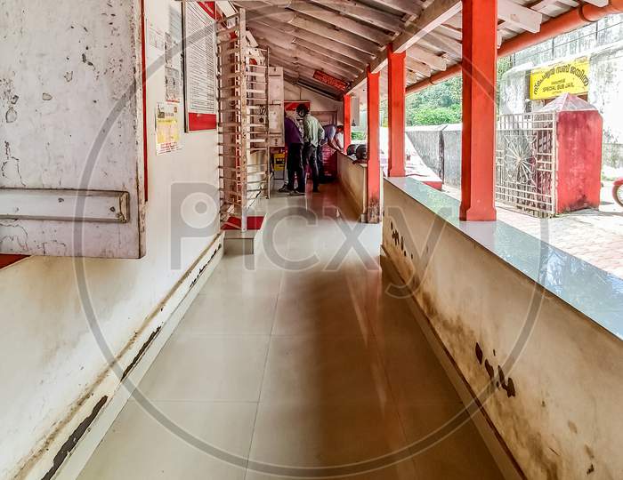 Vythiri, Kerala / India - 09.31.2020 : Ultra Wide Angle View Of Few People Standing In An Indian Post Office During Corona Virus Pandemic.