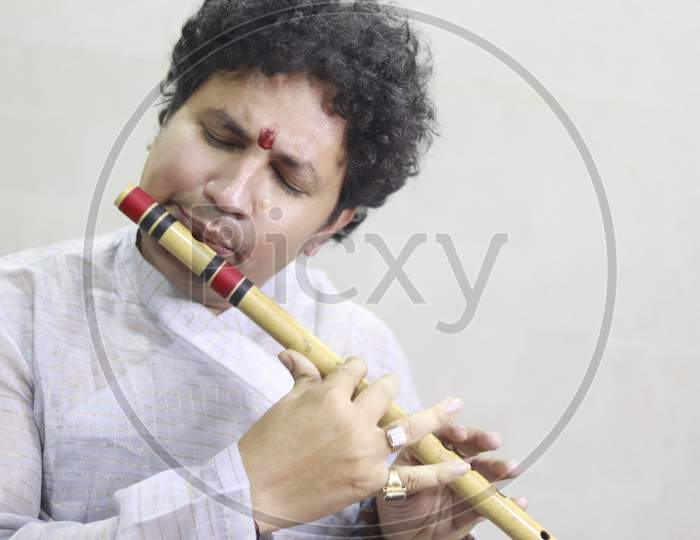 A Flute Artist playing Flute