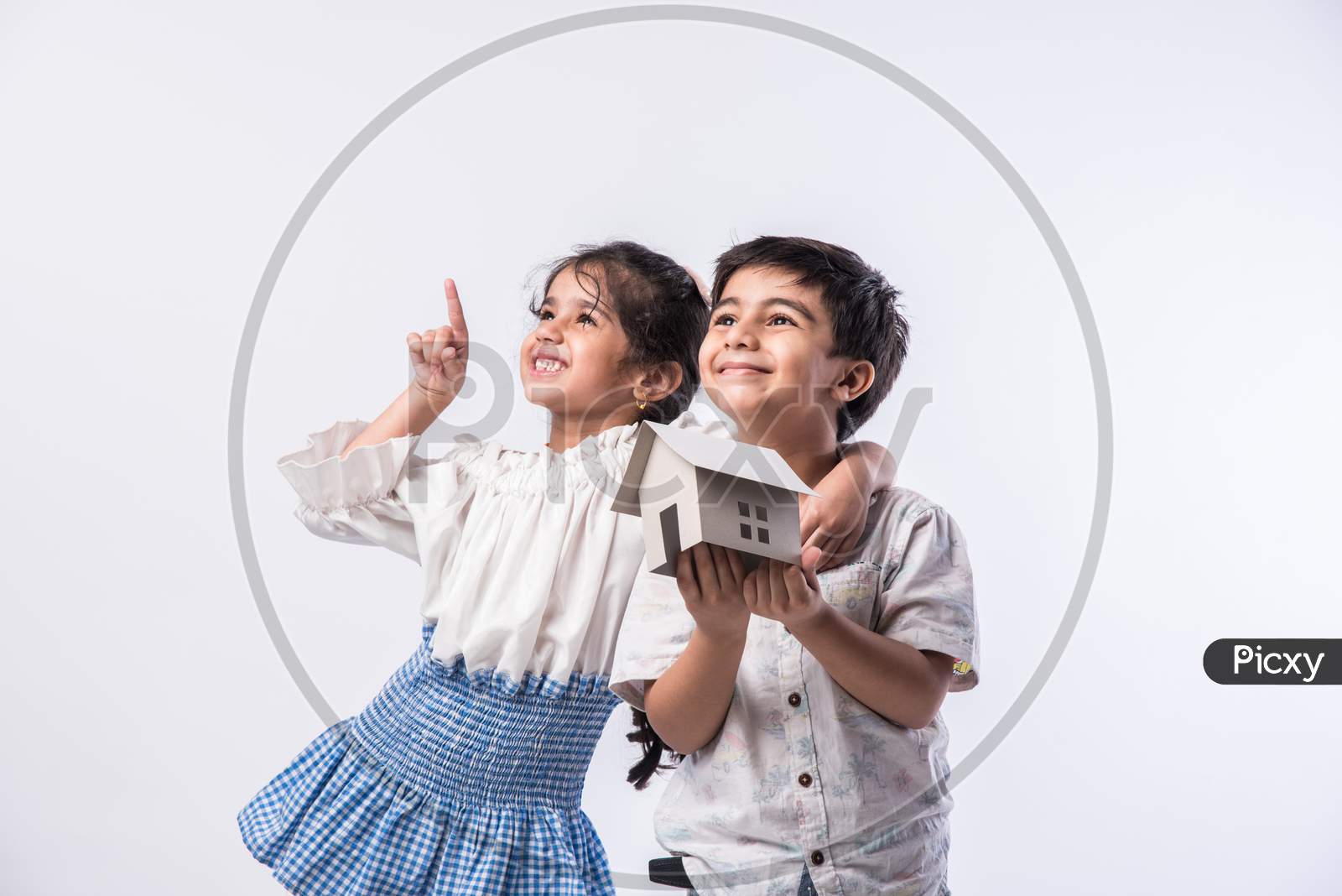 Real Estate Concept - Indian Cute Little Kids Holding #D Paper Model