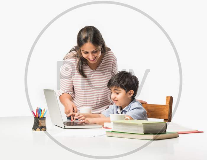 Online School In India Concept - Cute Little Son Taking Mother'S Help In Studies Or Homework