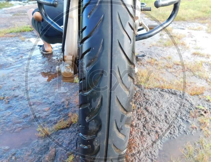 Closeup Of Motorcycle Tire In A Rock