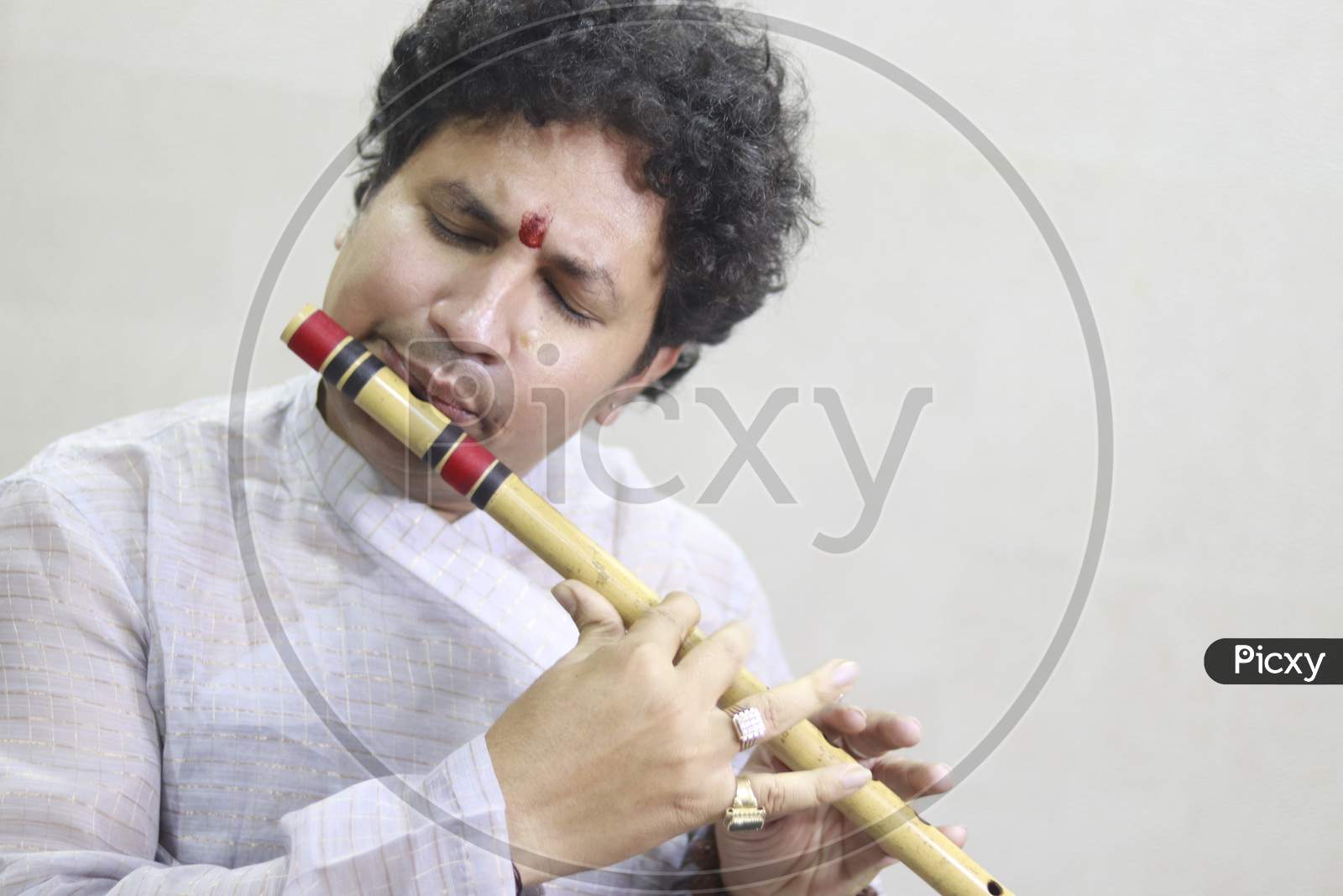 A Flute Artist playing Flute